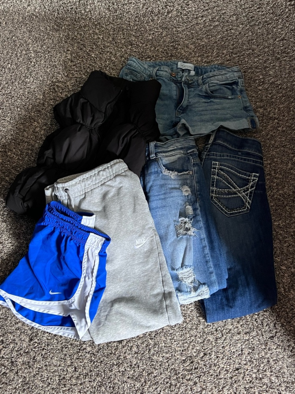 Whole bundle $60. Two pairs of jeans, one jean shorts, nike